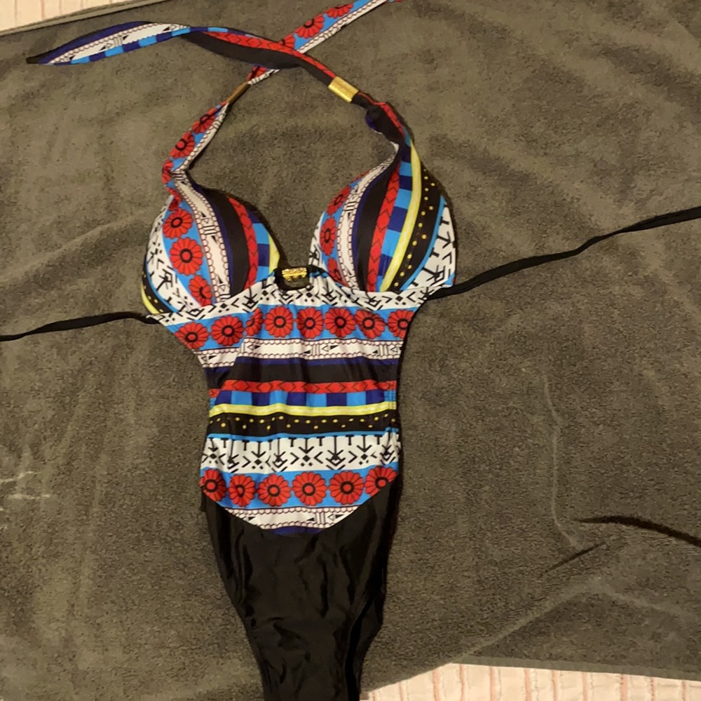 One piece bathing suit cut out sides runs small